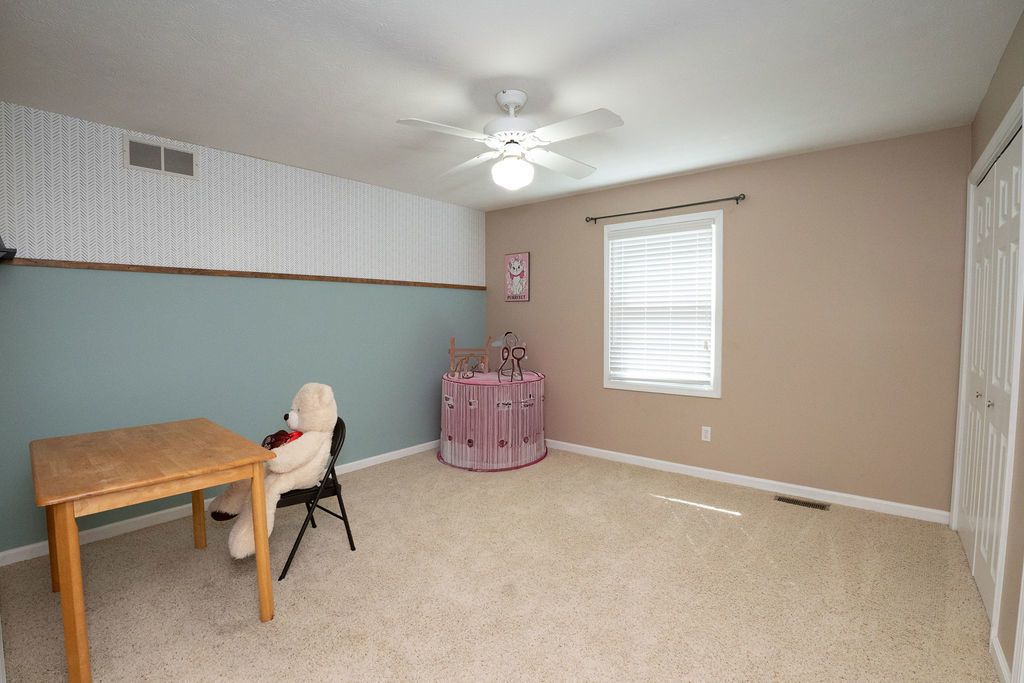 1708 Royal Pointe Drive Bloomington, IL 61704 - Photo 9 of 48 a dining room with furniture and chandelier fan