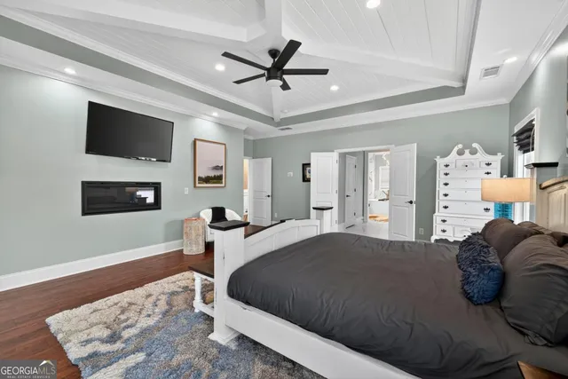 a hallway with painting on the wall and a shower