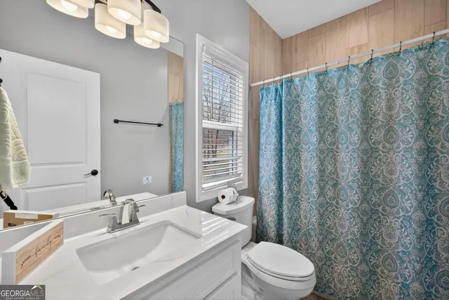 a bathroom with a toilet and a sink