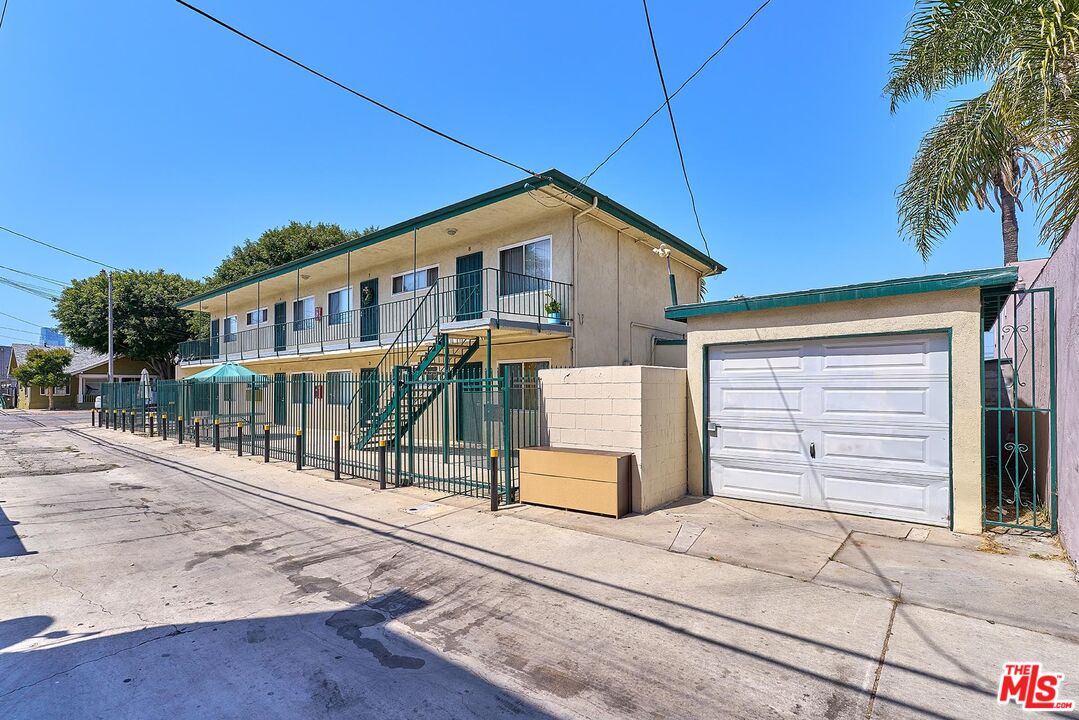815 East 9th Street Long Beach, CA 90813 - Photo 5 of 5 a front view of a house with a garden