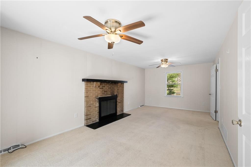 116 Fox Trot Drive Mars, PA 16046 - Photo 14 of 34 an empty room with windows and fireplace
