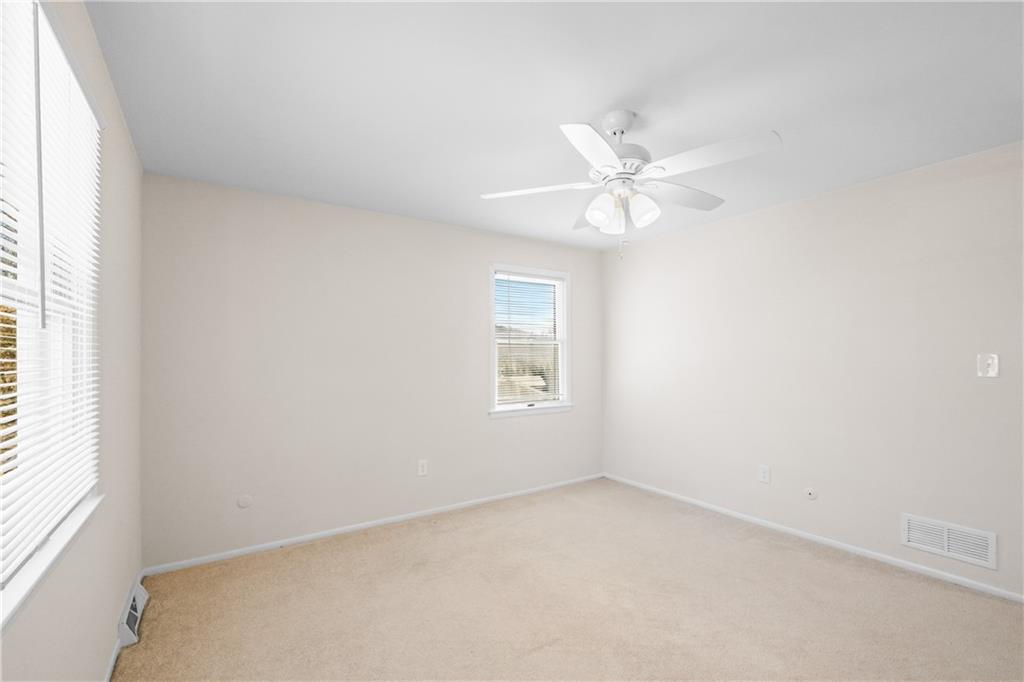 116 Fox Trot Drive Mars, PA 16046 - Photo 20 of 34 an empty room with a window and a ceiling fan