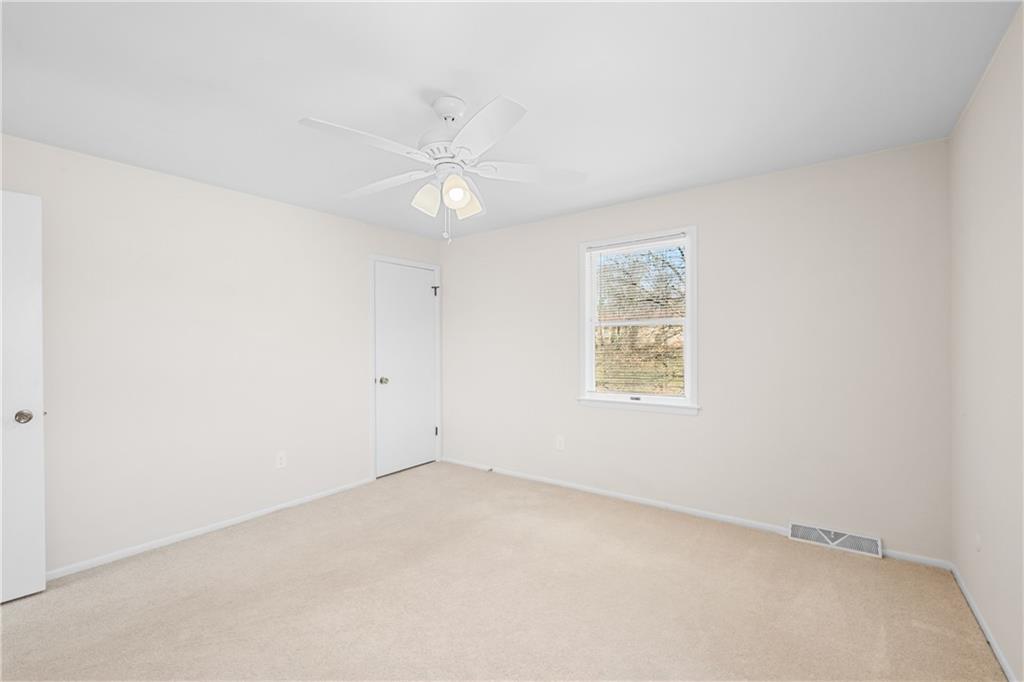116 Fox Trot Drive Mars, PA 16046 - Photo 21 of 34 an empty room with a window and ceiling fan