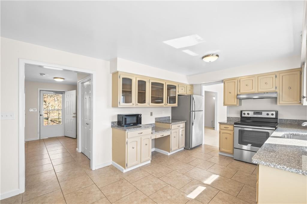 116 Fox Trot Drive Mars, PA 16046 - Photo 7 of 34 a kitchen with stainless steel appliances granite countertop a stove oven and a refrigerator