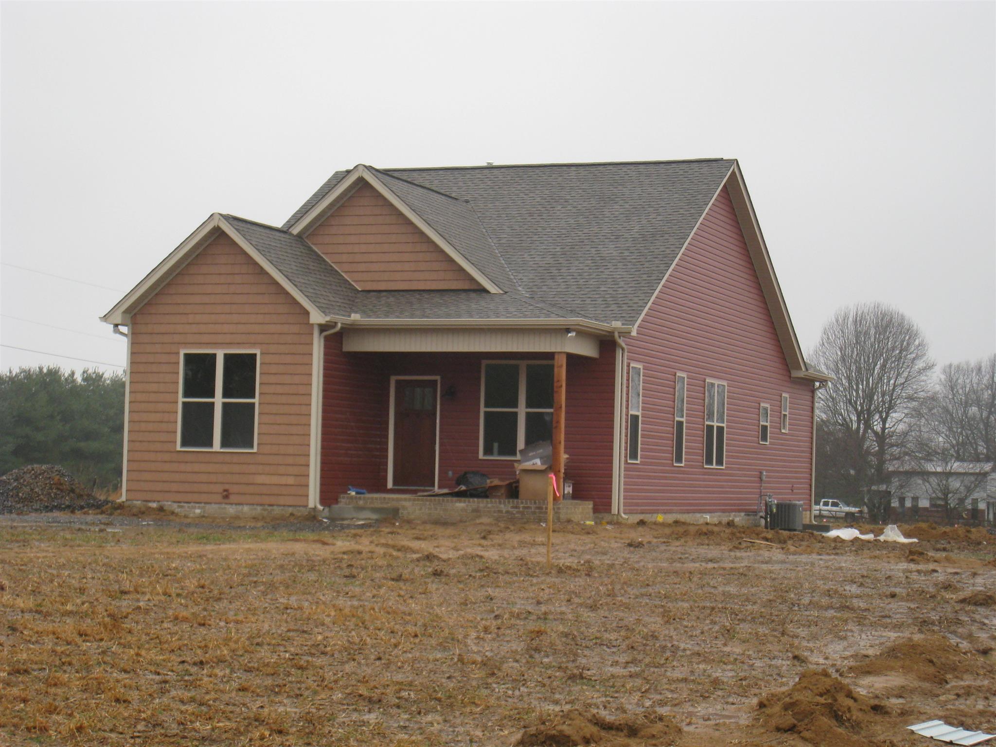 330 East Biggs Road Portland, TN 37148 - Photo 1 of 9 a front view of a house with garden