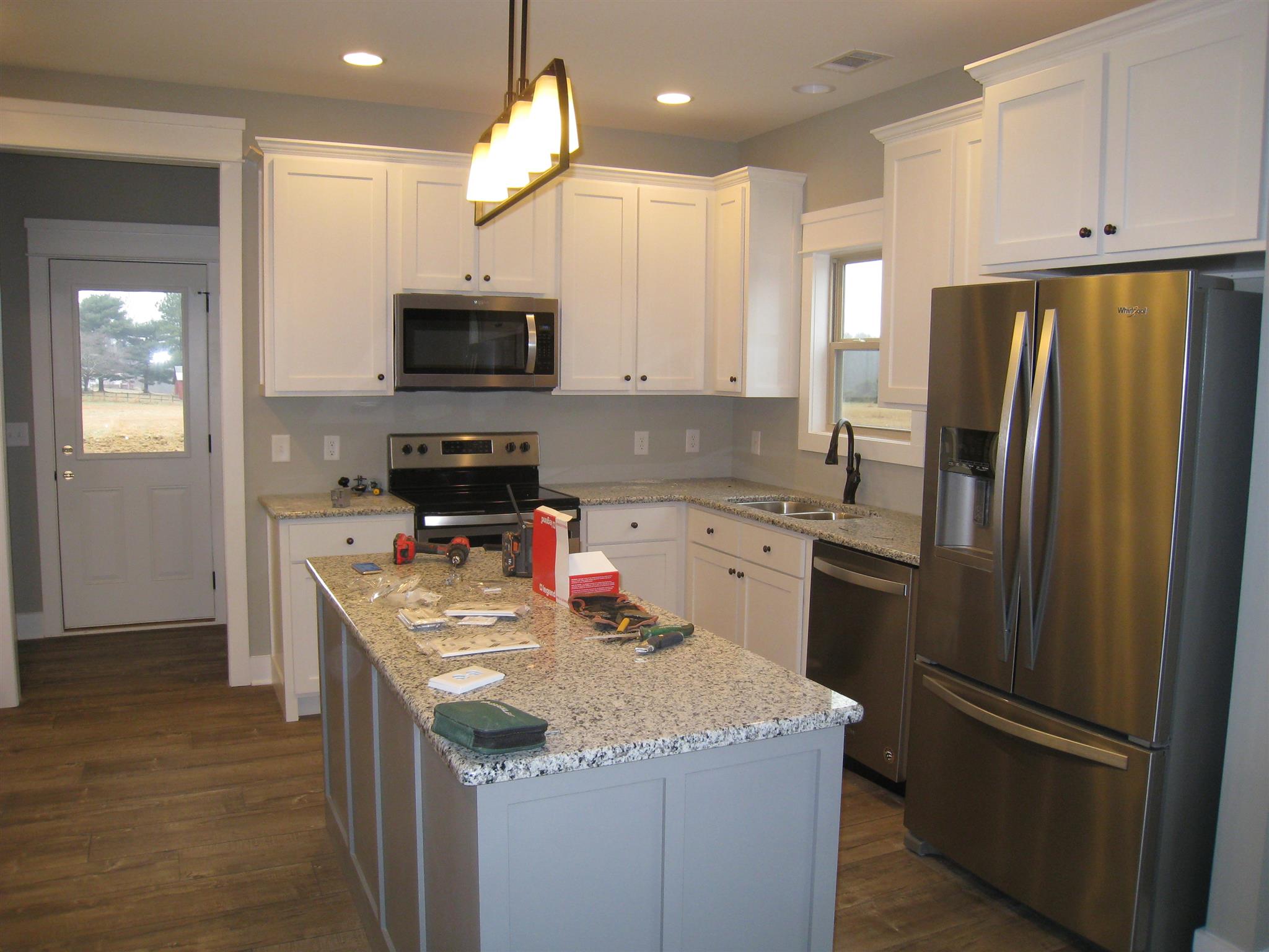 330 East Biggs Road Portland, TN 37148 - Photo 7 of 9 a kitchen with stainless steel appliances granite countertop a refrigerator stove a sink and a microwave