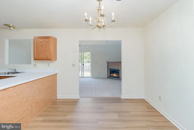 a view of kitchen with granite countertop cabinets a sink and dishwasher