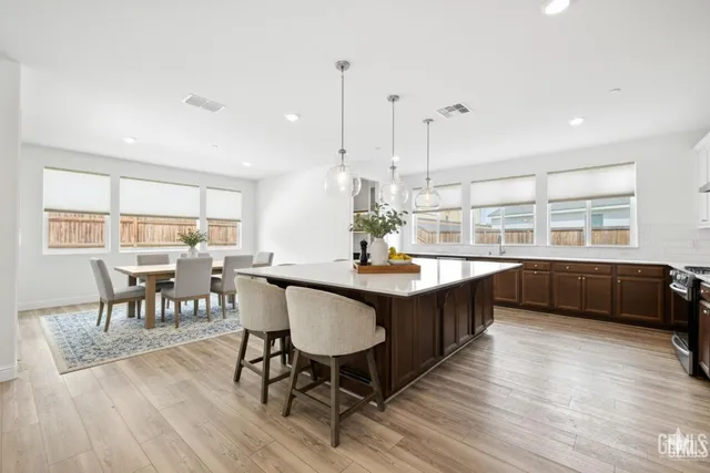 a kitchen sink with a granite countertop window