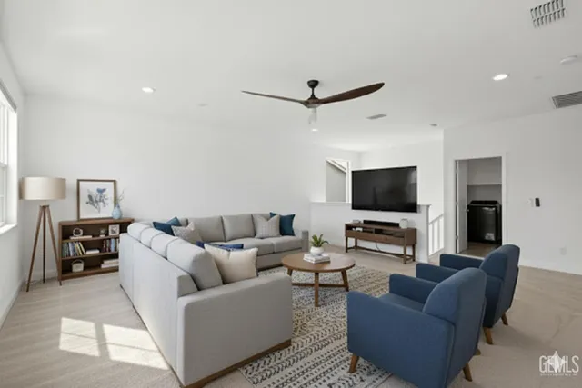 a bed room with a bed and a chair