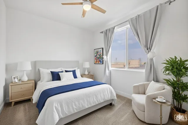 an aerial view of a house with swimming pool and furniture