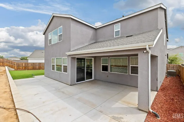 an aerial view of a house with a swimming pool