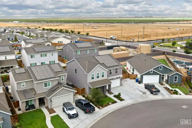 a view of sign board with plants