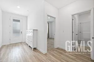 a bathroom with a granite countertop sink a toilet and shower