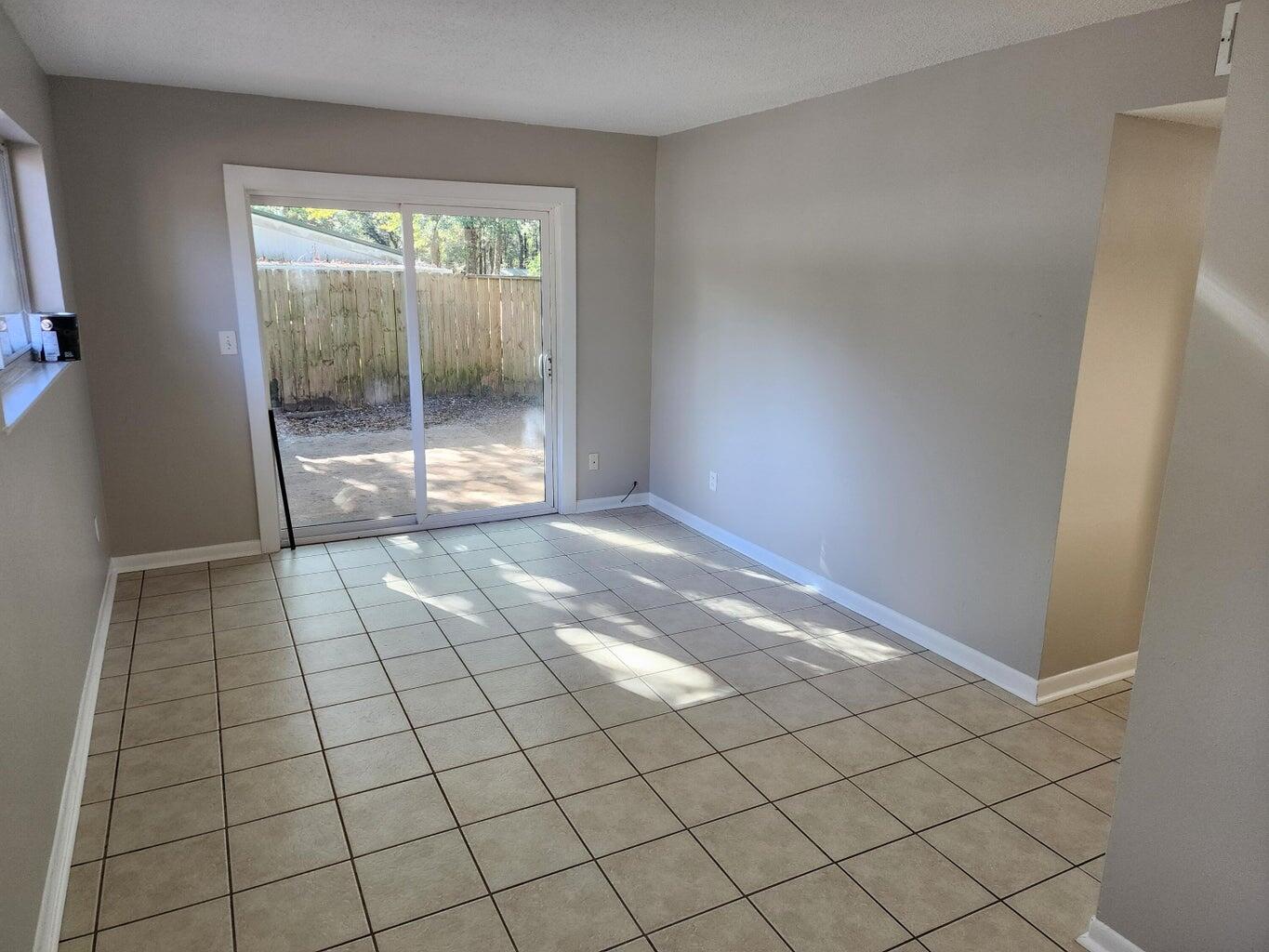 128 Smith Street Crestview, FL 32539 - Photo 2 of 13 a view of an empty room and window