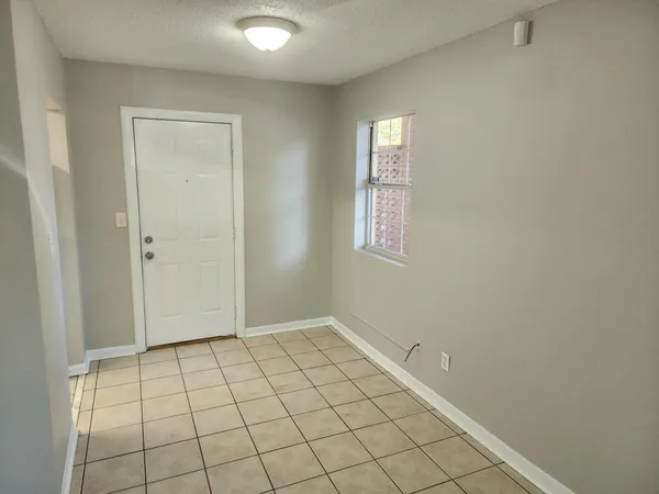 a view of an empty room and window