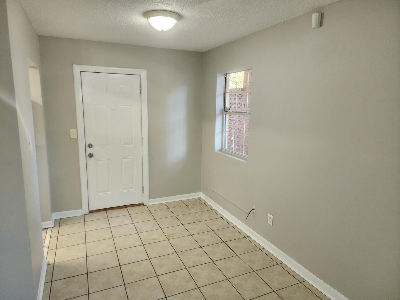 128 Smith Street Crestview, FL 32539 - Photo 3 of 13 a view of an empty room and window
