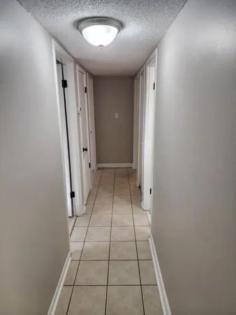 a bathroom with a sink a toilet a mirror and shower