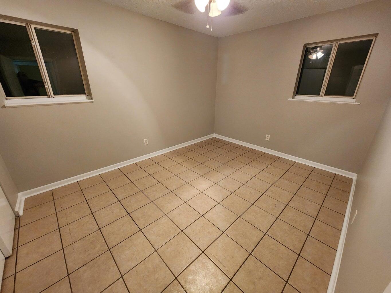 128 Smith Street Crestview, FL 32539 - Photo 10 of 13 a view of an empty room and window