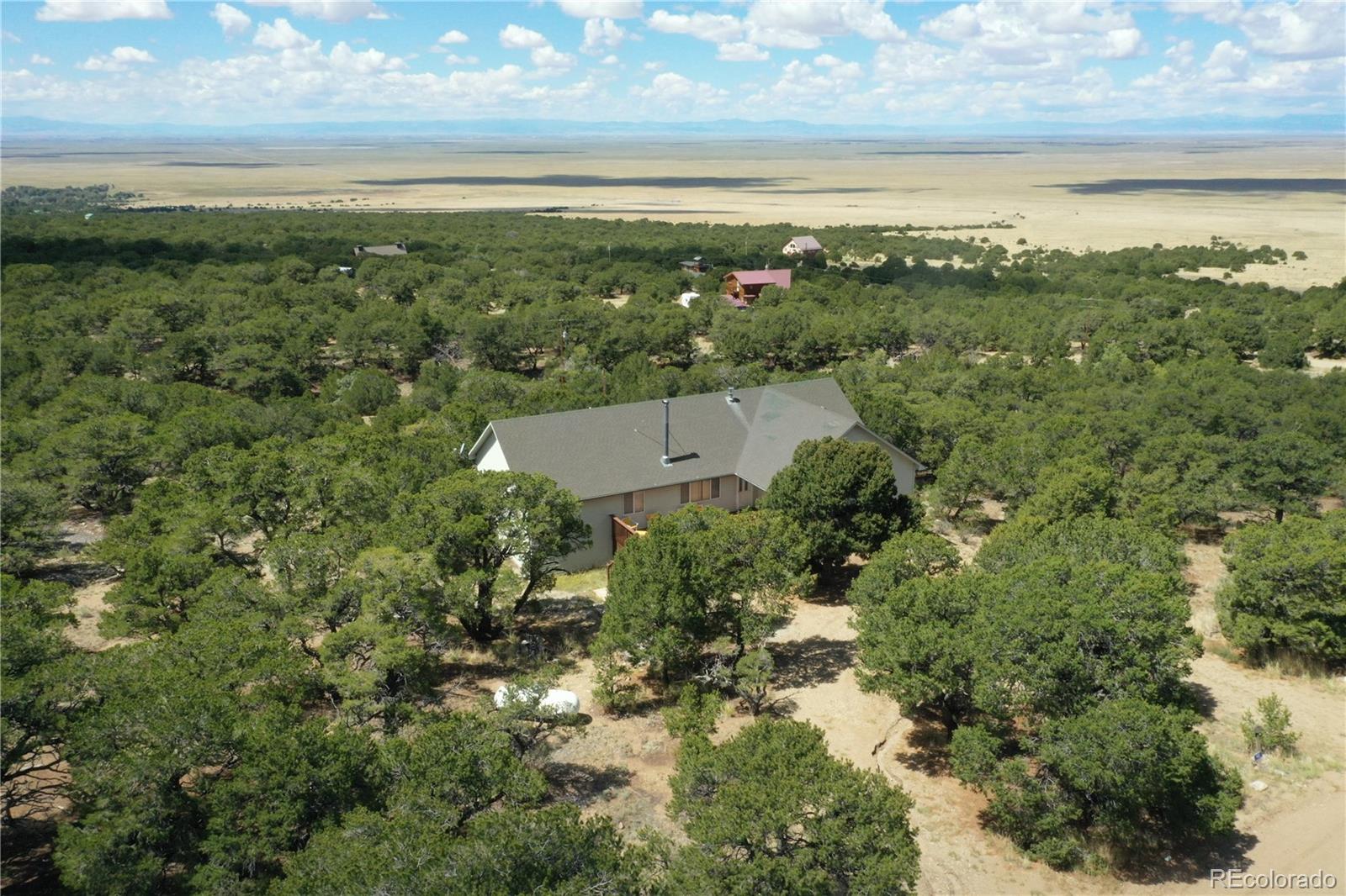 162 Cedar Ridge Road Mosca, CO 81146 - Photo 2 of 24 a view of a city with an ocean