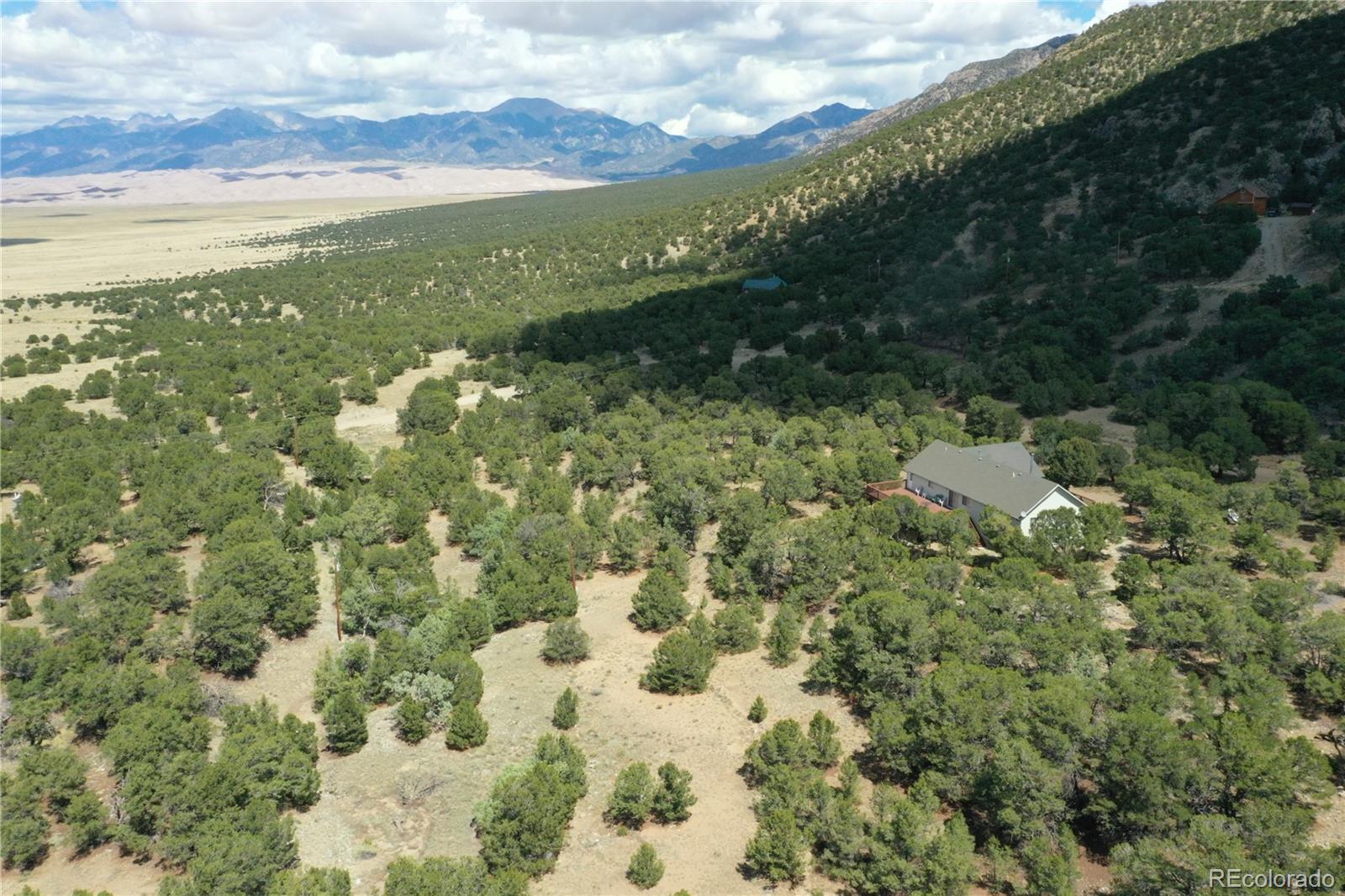 162 Cedar Ridge Road Mosca, CO 81146 - Photo 22 of 24 a view of lake with mountain