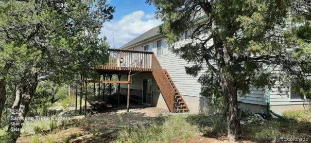 a view of a house with a tree