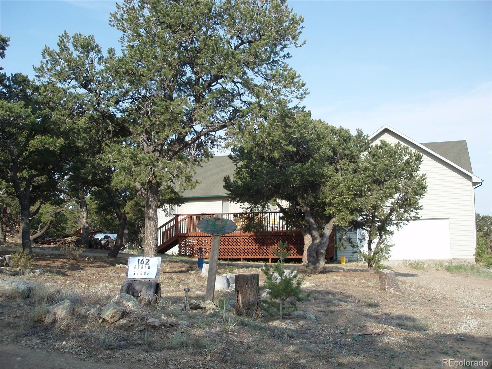 162 Cedar Ridge Road Mosca, CO 81146 - Photo 3 of 24 a view of a sitting area with large trees