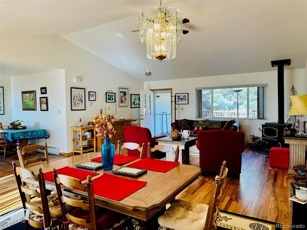 a living room with lots of furniture and a chandelier