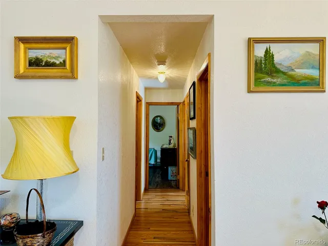 a view of a hallway with a small dining room