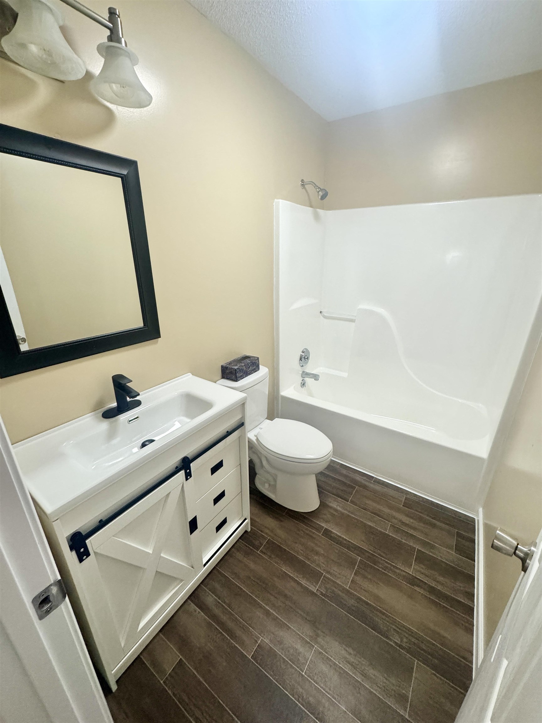 250 Dr Lewis Road Ripley, TN 38063 - Photo 12 of 18 a bathroom with a double vanity sink mirror and toilet