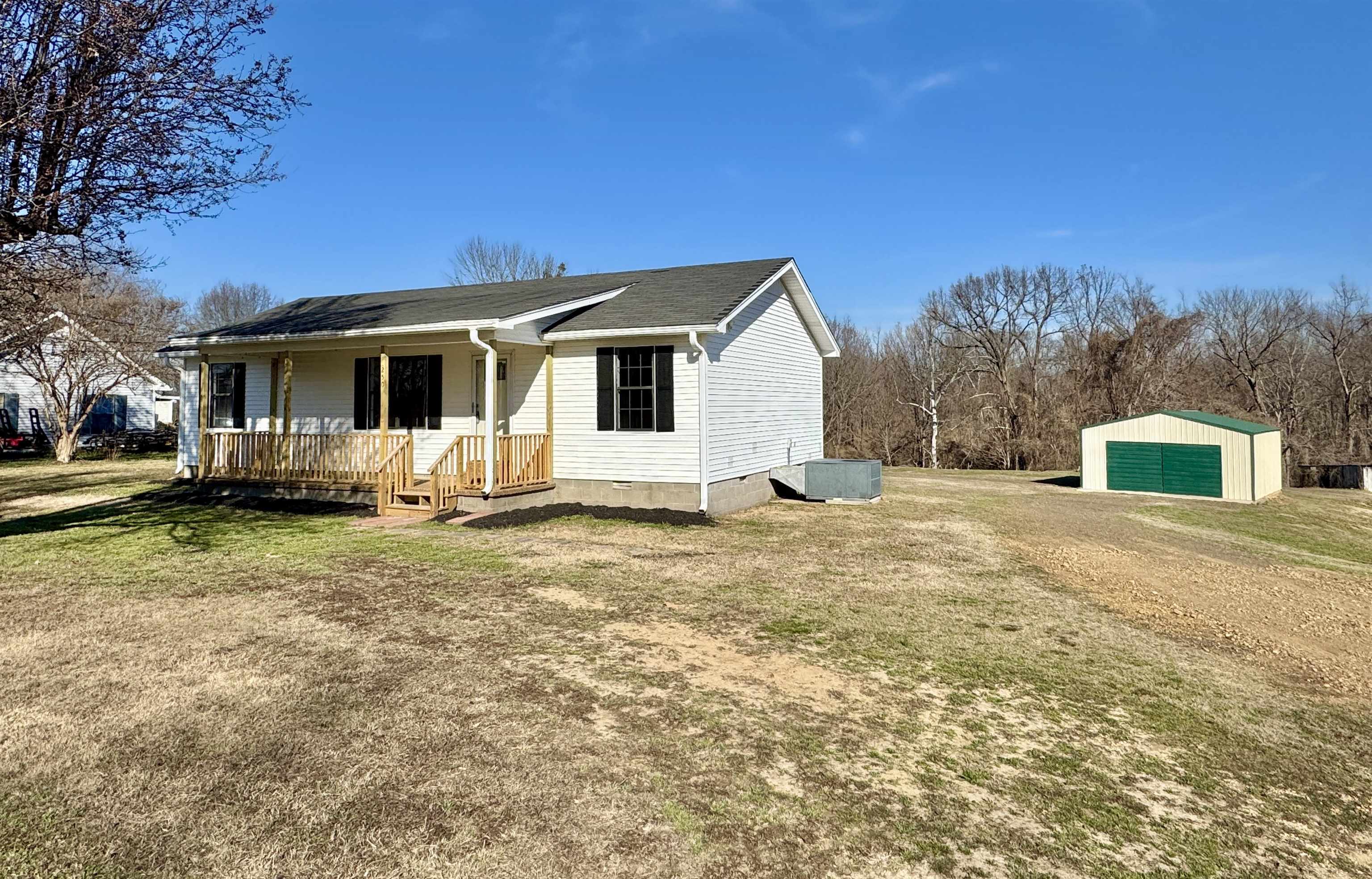 250 Dr Lewis Road Ripley, TN 38063 - Photo 4 of 18 a front view of a house with a yard and trees