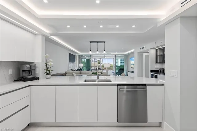 a kitchen with stainless steel appliances granite countertop a sink and cabinets