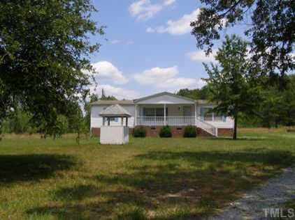 3805 Bowmantown Road, Unit 1 Roxboro, NC 27574 - Photo 1 of 1 a front view of a house with a garden