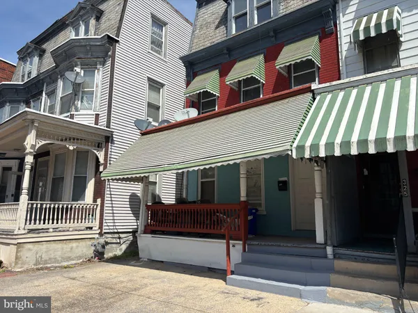 a front view of a house with a garage