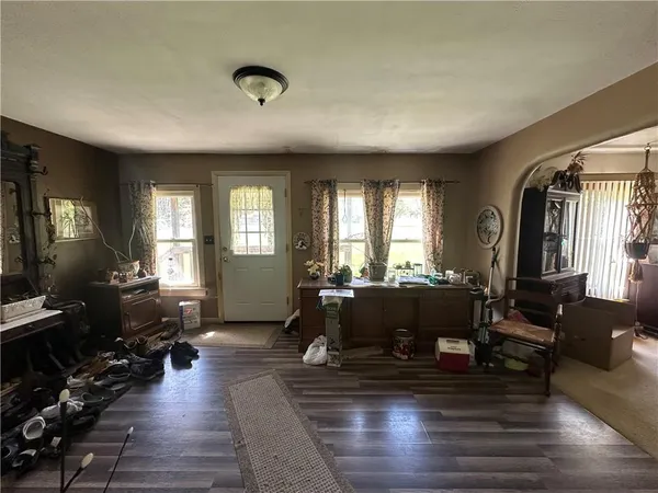 a kitchen with a refrigerator and a sink