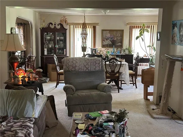 a bedroom with furniture and a window