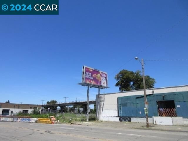 a view of a street with a building in the background