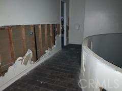 14733 Juniper Street Hesperia, CA 92345 - Photo 7 of 9 a view of a hallway with wooden floor