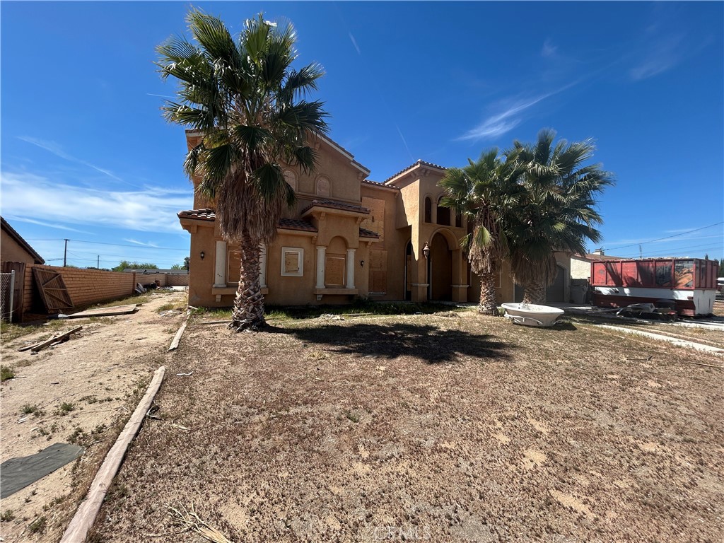 14733 Juniper Street Hesperia, CA 92345 - Photo 9 of 9 a view of a house with a yard