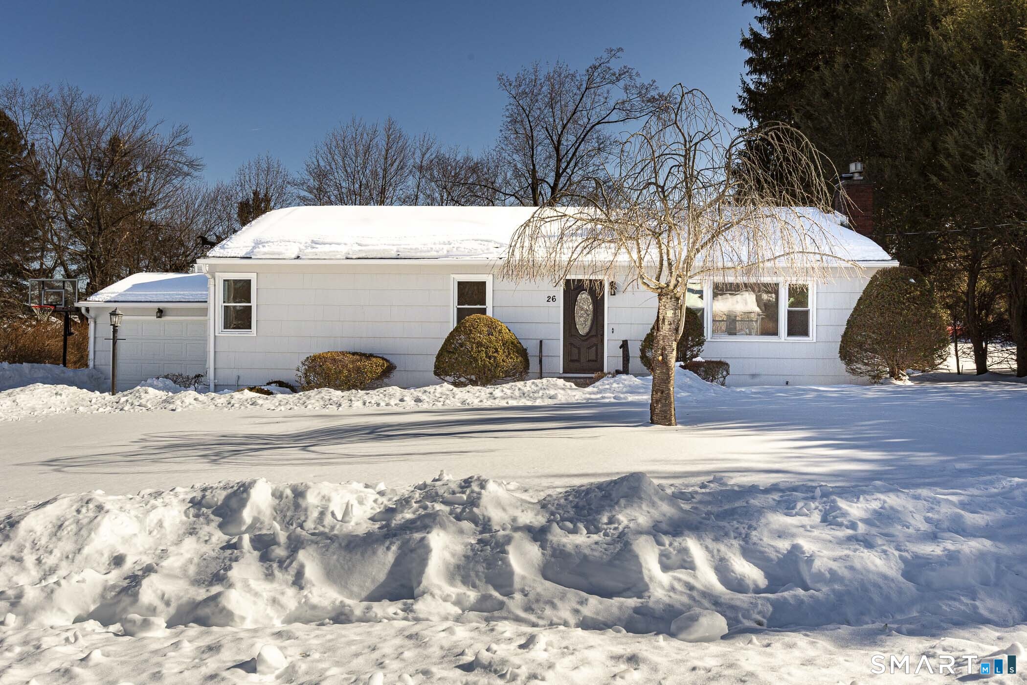 26 Kelly Road Hamden, CT 06518 - Photo 3 of 37 a view of a house with snow on the background
