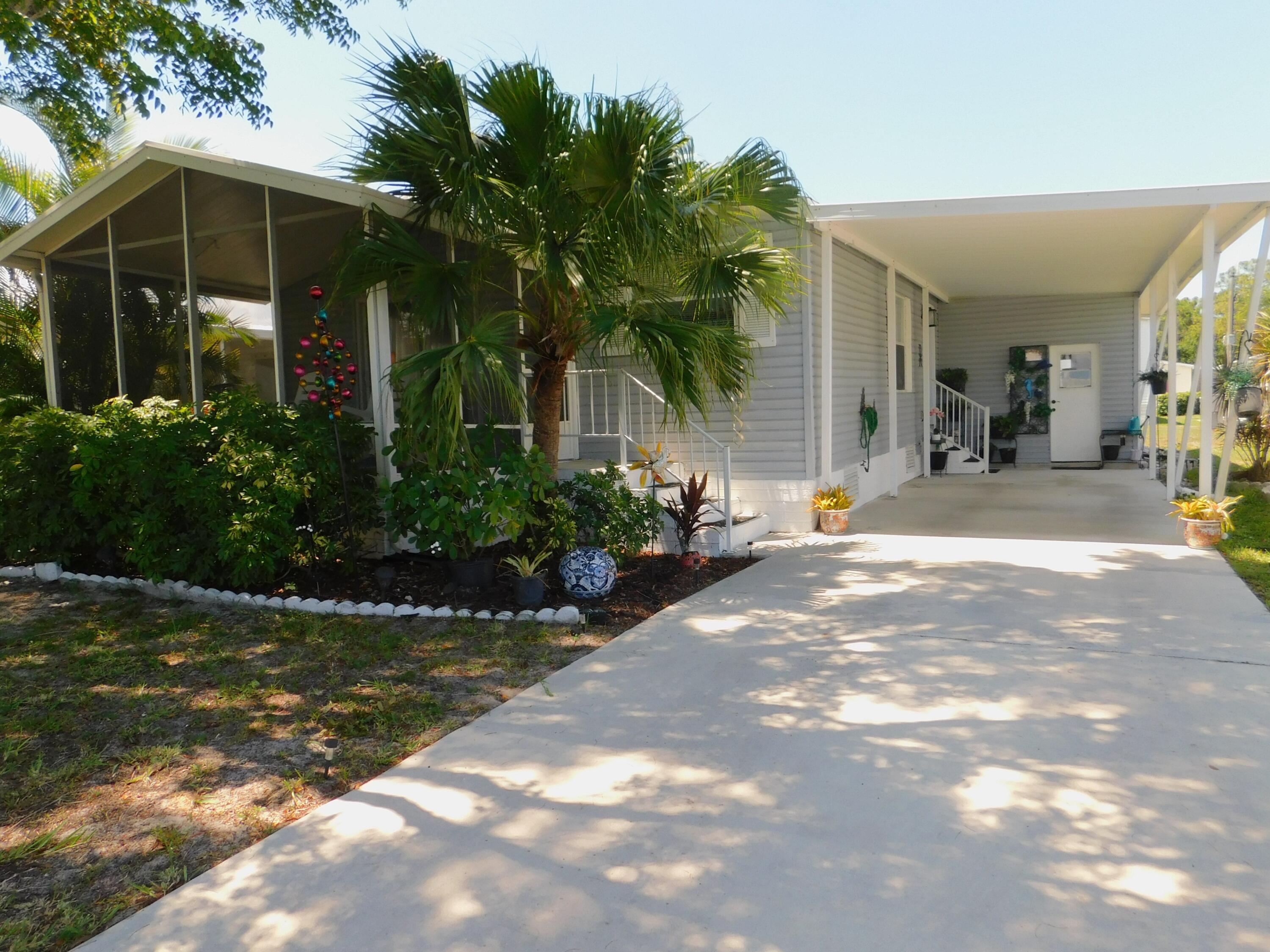 376 Seahorse Terrace Fort Pierce, FL 34982 - Photo 1 of 16 a view of a house with backyard and porch