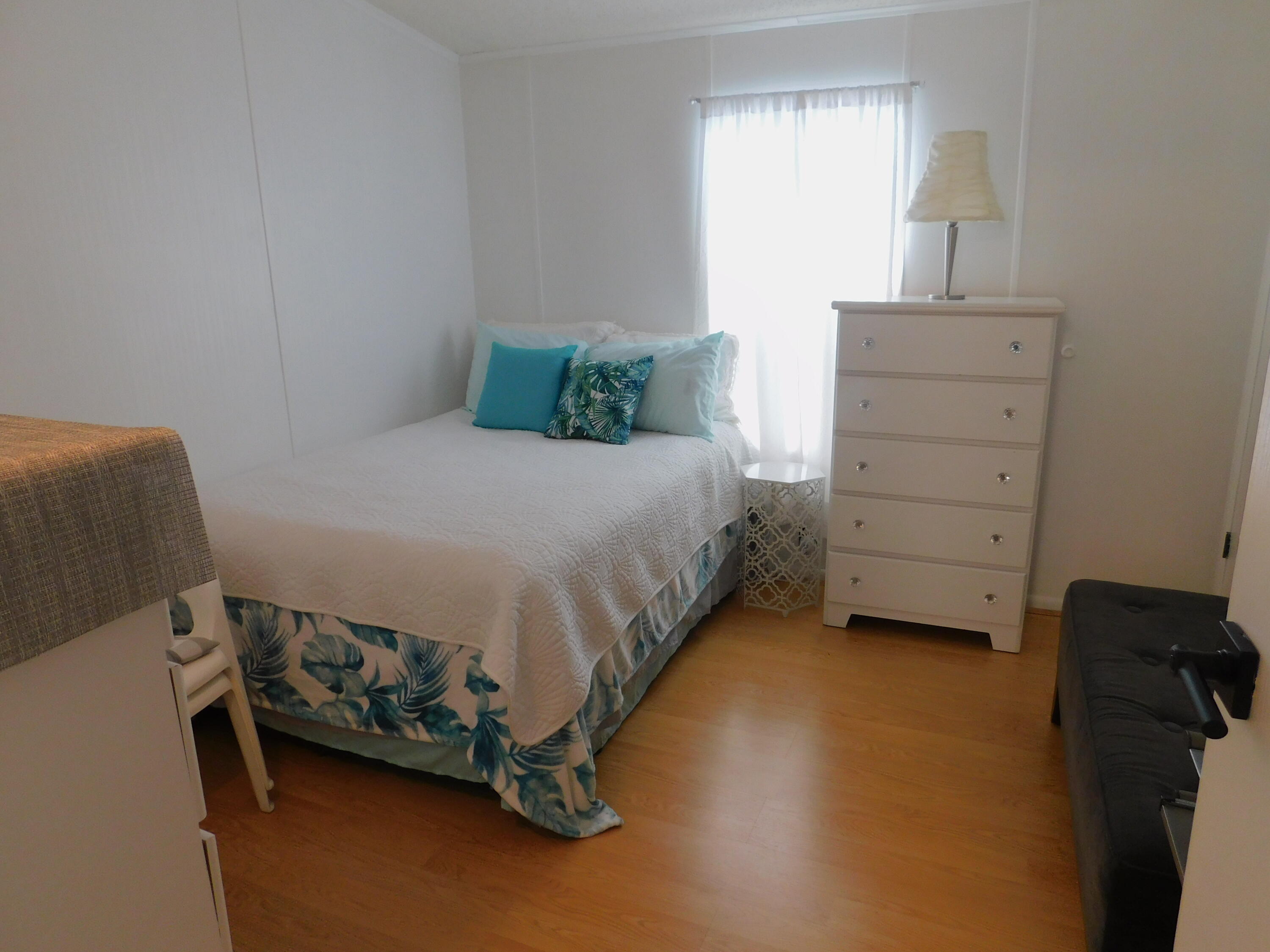 376 Seahorse Terrace Fort Pierce, FL 34982 - Photo 13 of 16 a bedroom with a bed and a window