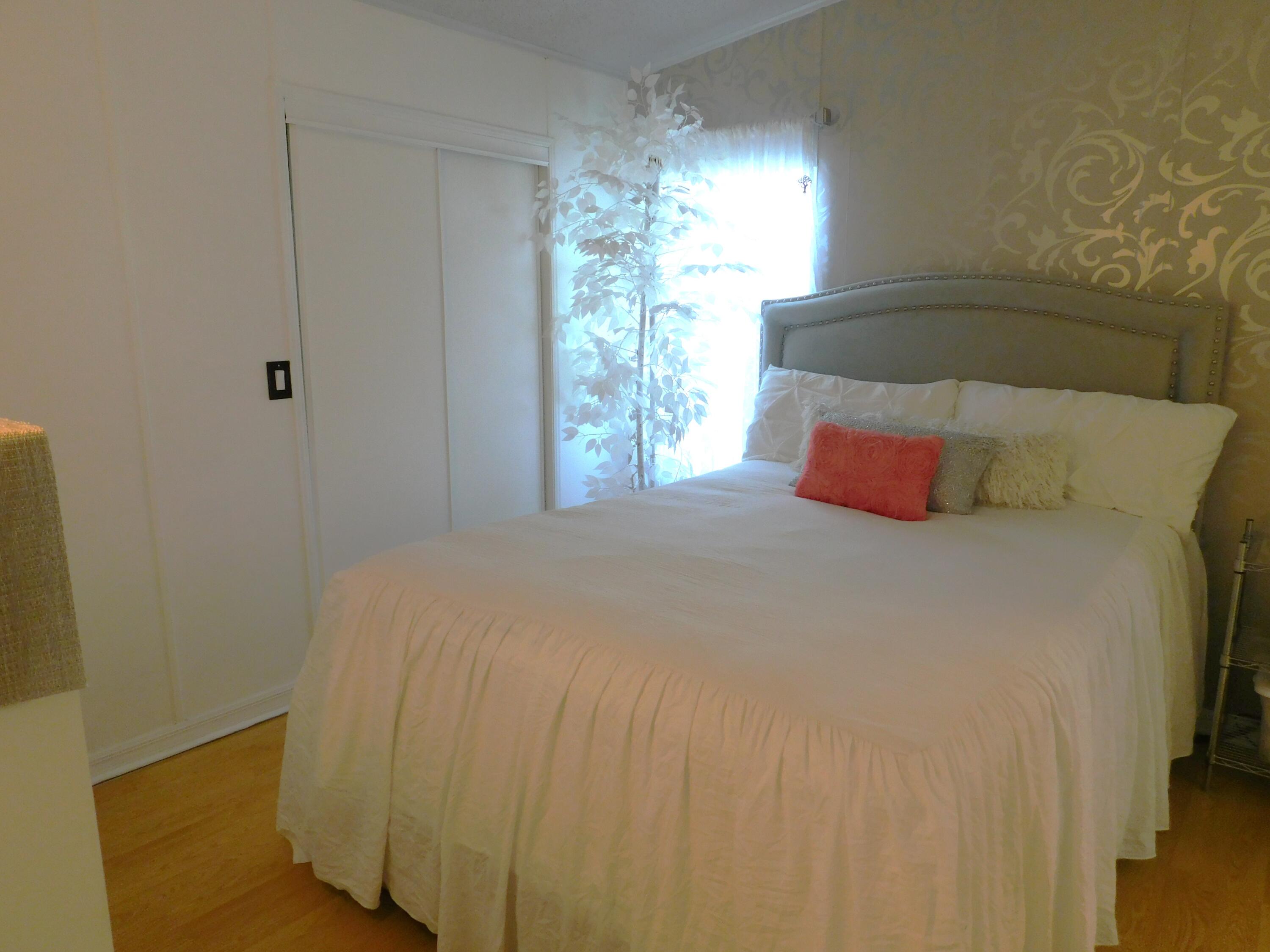 376 Seahorse Terrace Fort Pierce, FL 34982 - Photo 14 of 16 a bedroom with a bed and a window