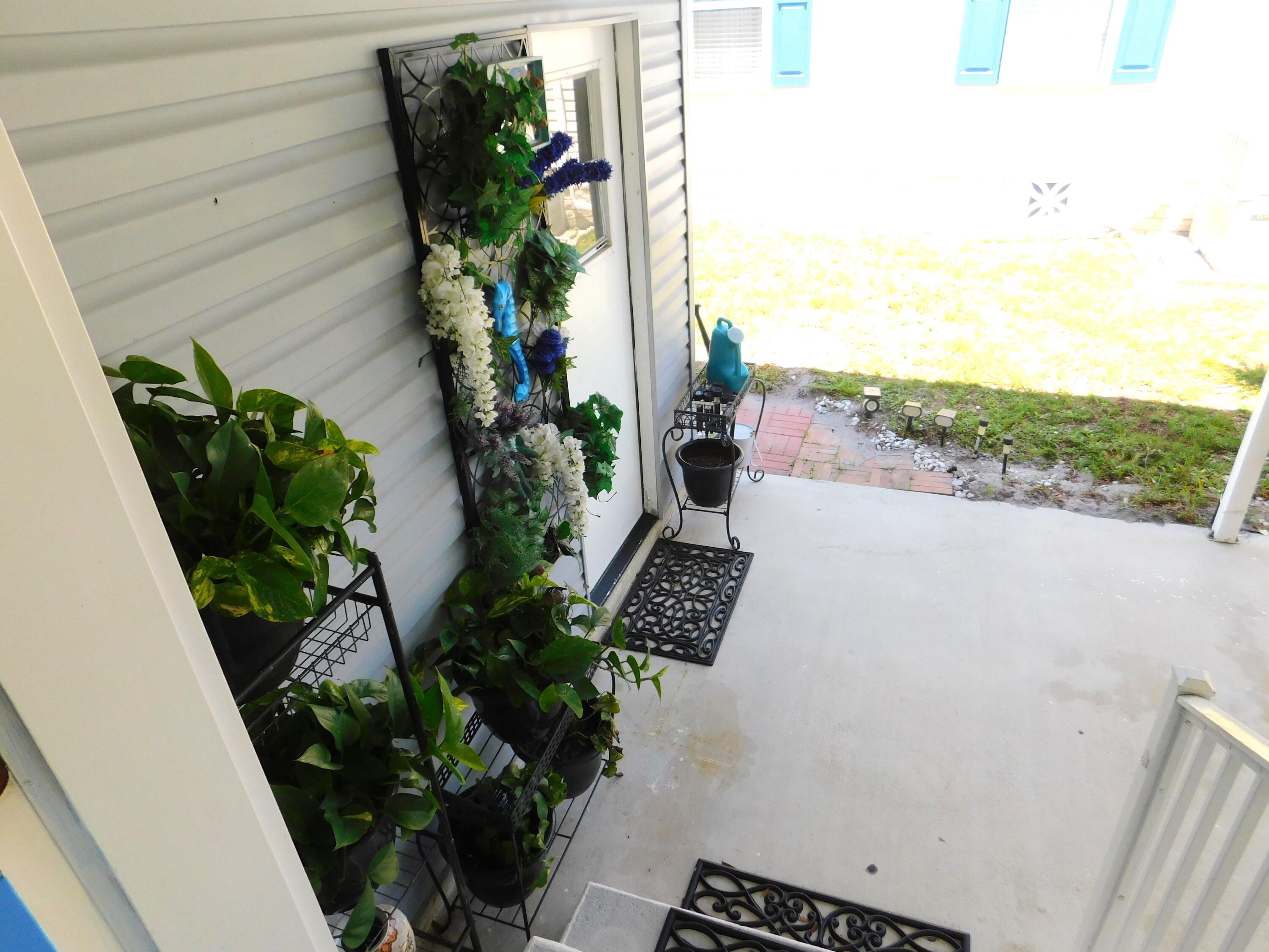 376 Seahorse Terrace Fort Pierce, FL 34982 - Photo 4 of 16 a view of a potted flower in a corridor