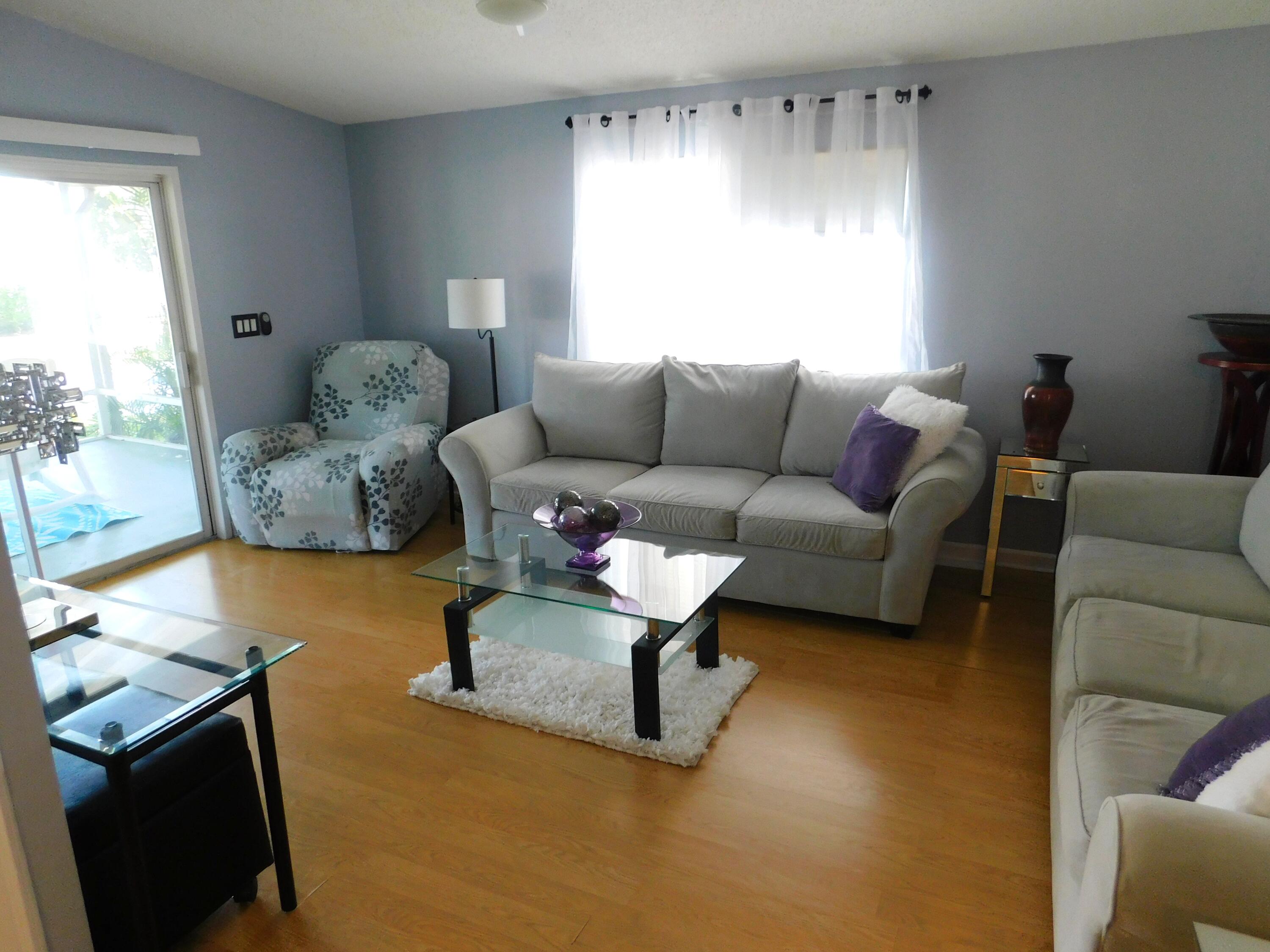 376 Seahorse Terrace Fort Pierce, FL 34982 - Photo 8 of 16 a living room with furniture and a large window