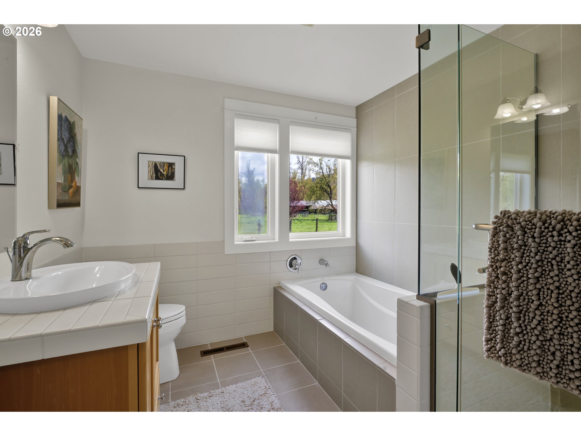 7924 Thurston Road Springfield, OR 97478 - Photo 30 of 45 a bathroom with a bathtub sink and mirror