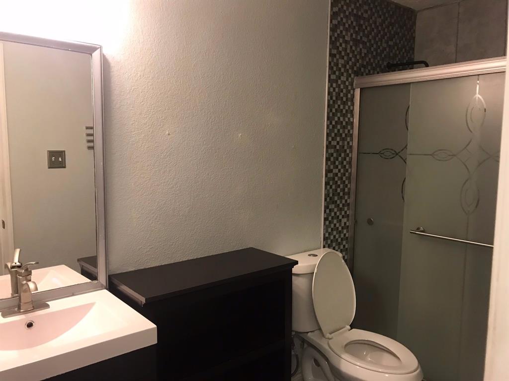 3820 Bandera Ranch Road Fort Worth, TX 76262 - Photo 26 of 34 Full bathroom featuring vanity, a shower stall, and a textured wall