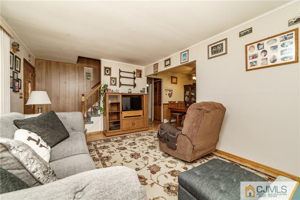 369 Amherst Road Linden, NJ 07036 - Photo 3 of 23 a living room with furniture and a couch
