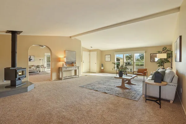 a large kitchen with stainless steel appliances granite countertop a lot of counter space and wooden floors