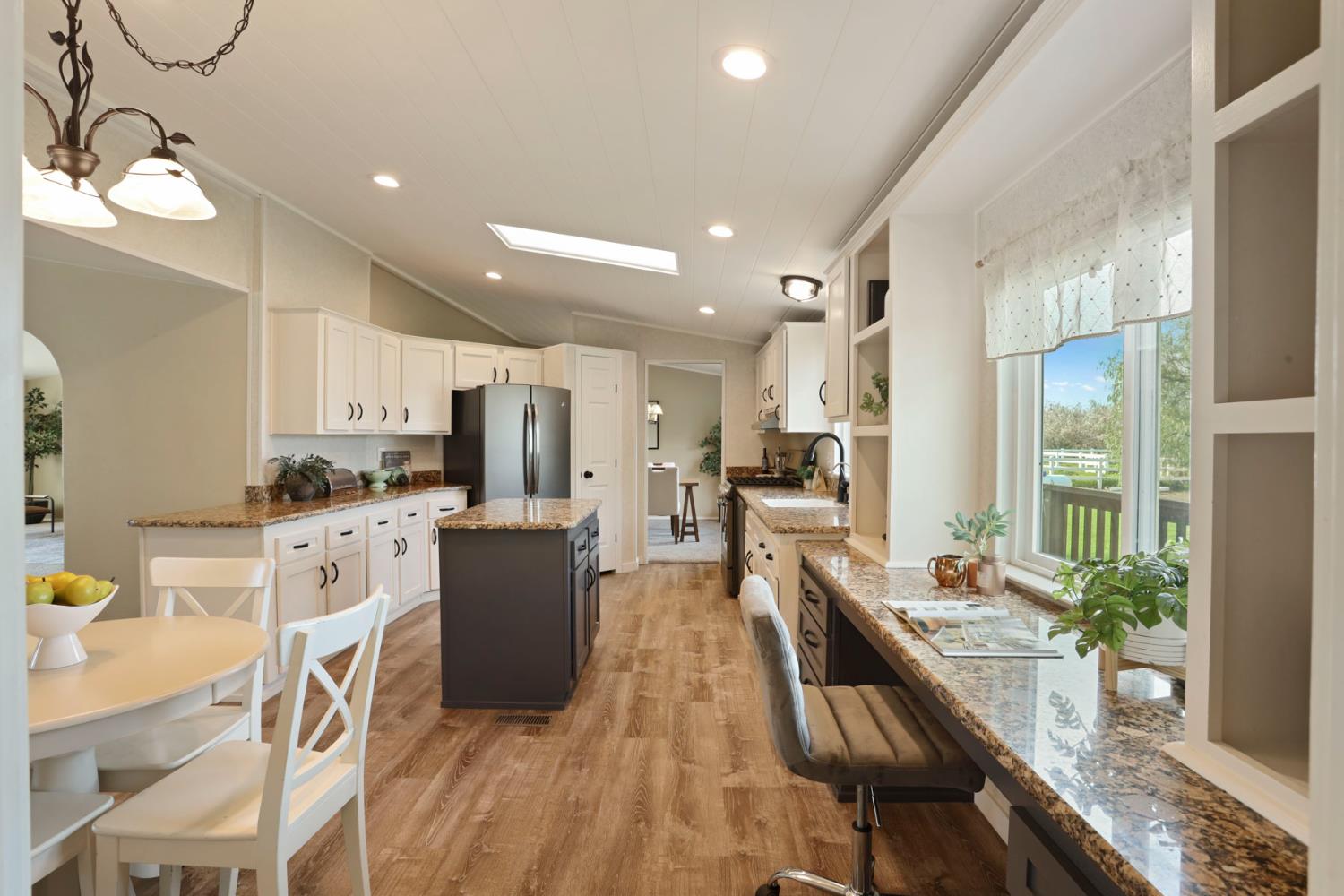 3320 Durham Ferry Road Tracy, CA 95304 - Photo 24 of 77 a kitchen with white cabinets and stainless steel appliances