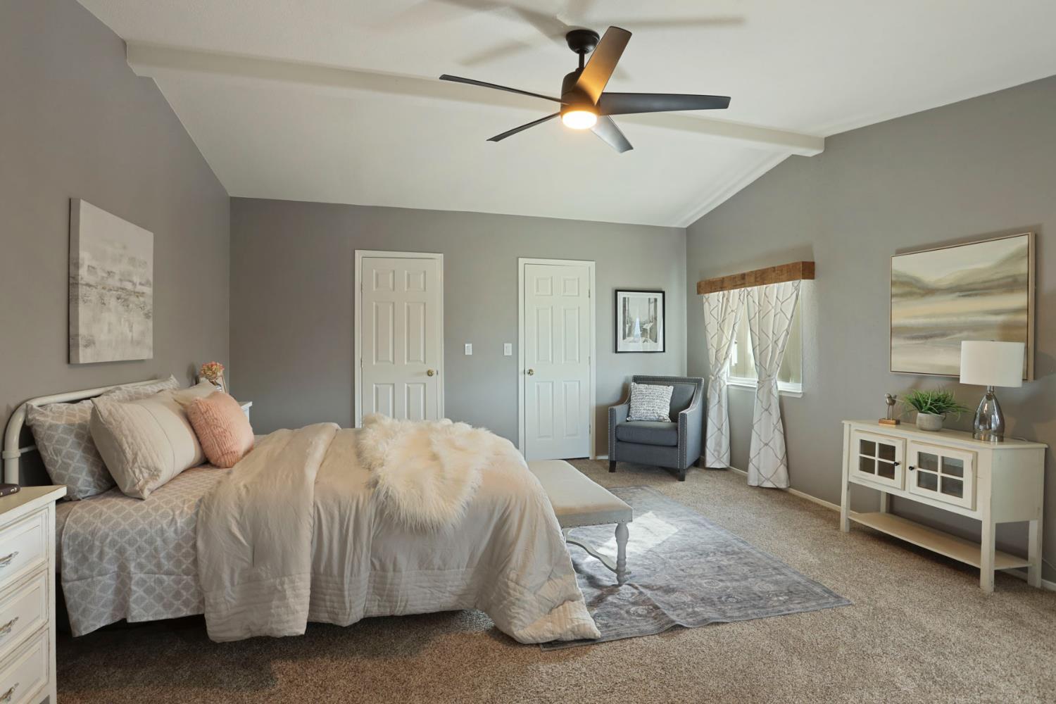 3320 Durham Ferry Road Tracy, CA 95304 - Photo 35 of 77 a bedroom with a bed and a chandelier